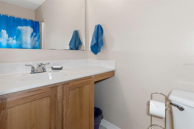 bathroom with vanity and toilet