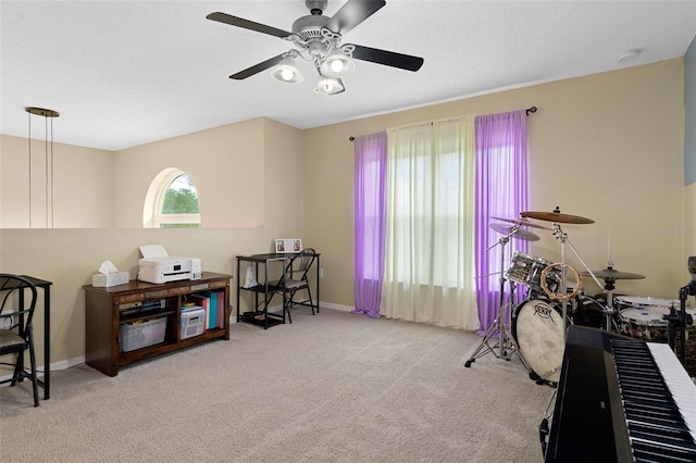 interior space featuring ceiling fan and light carpet