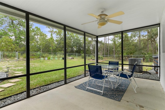 sunroom with plenty of natural light and ceiling fan