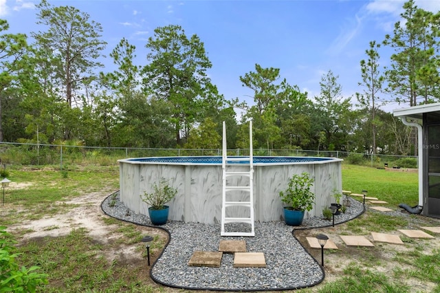 exterior space featuring a fenced in pool