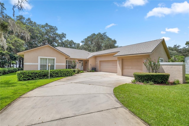 ranch-style home featuring a garage and a front yard