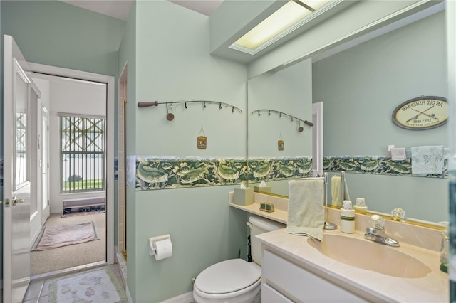 bathroom with tile patterned floors, toilet, and vanity