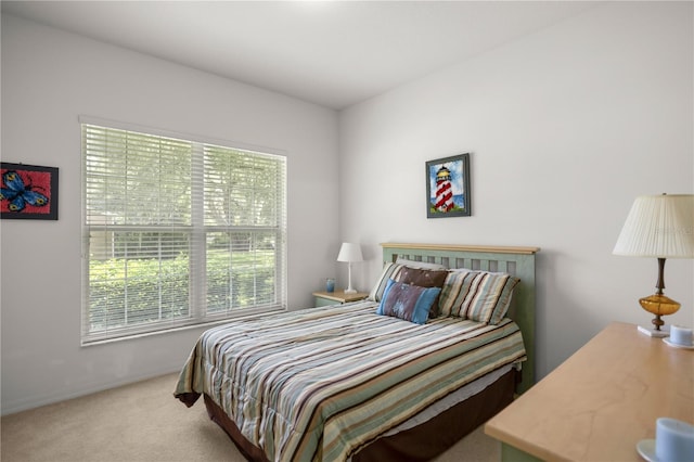 bedroom featuring light colored carpet