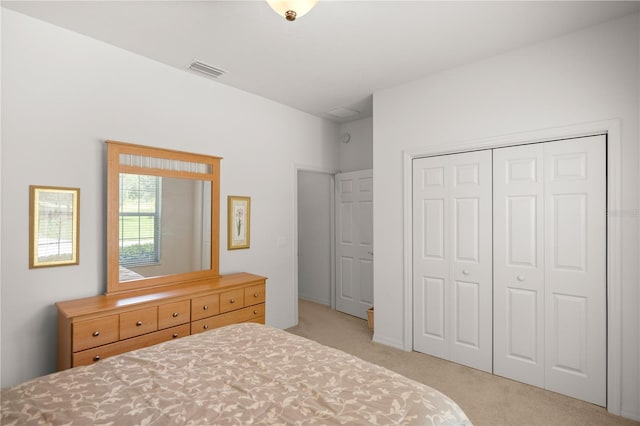 carpeted bedroom featuring a closet