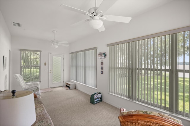 sunroom / solarium with ceiling fan