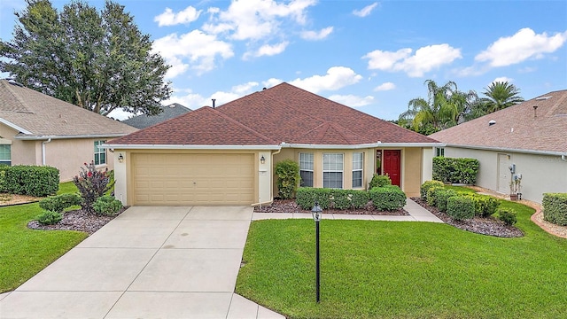 single story home featuring a garage and a front lawn