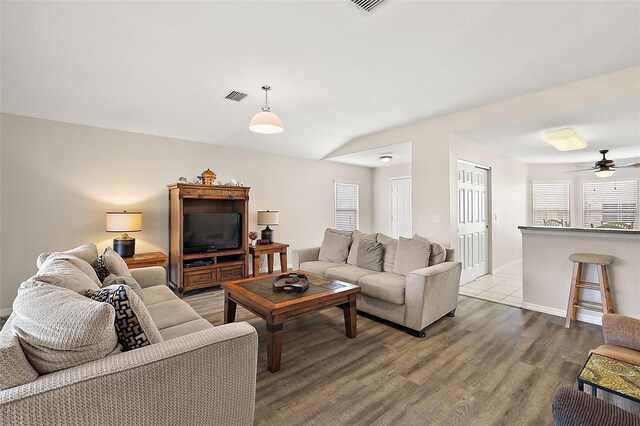 living room with hardwood / wood-style floors and ceiling fan