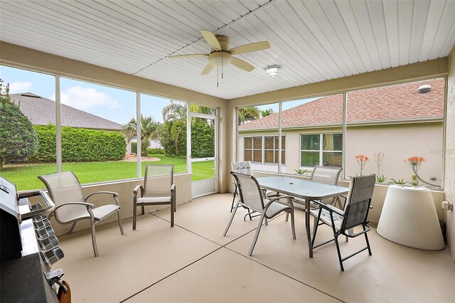 sunroom with a wealth of natural light and ceiling fan