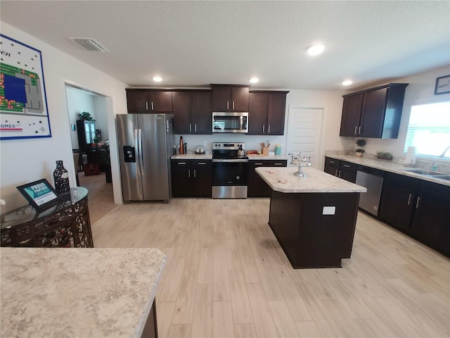 kitchen with visible vents, a sink, recessed lighting, light wood-style floors, and appliances with stainless steel finishes