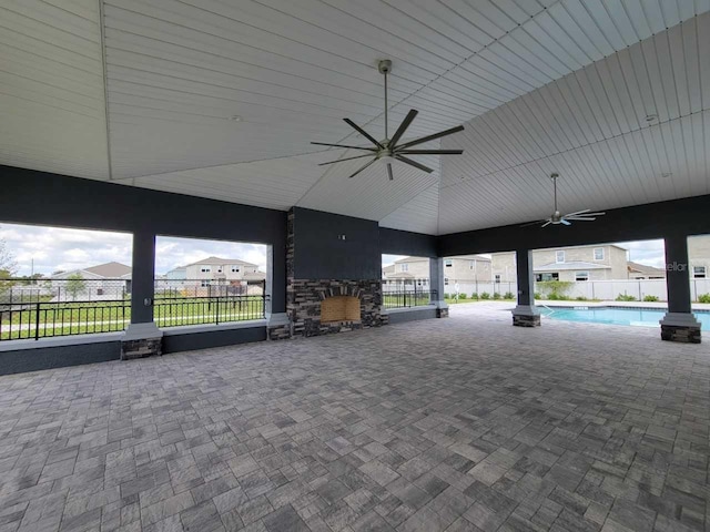 view of patio featuring fence, a fenced in pool, and ceiling fan