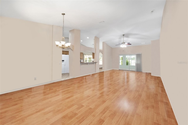 16369 SW 14th Avenue Rd, Ocala, FL 34473 - unfurnished living room featuring a chandelier, lofted ceiling, light wood-type flooring, and a ceiling fan