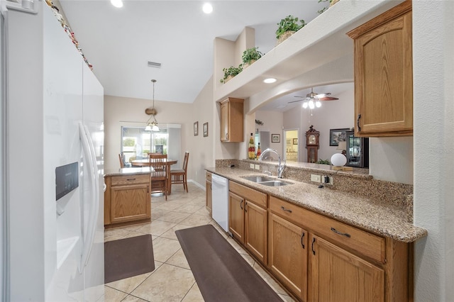 kitchen with white appliances, decorative light fixtures, kitchen peninsula, sink, and ceiling fan