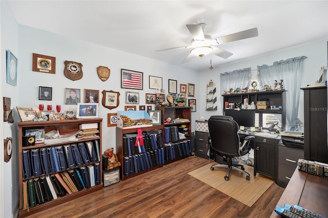 office with dark wood-type flooring and ceiling fan