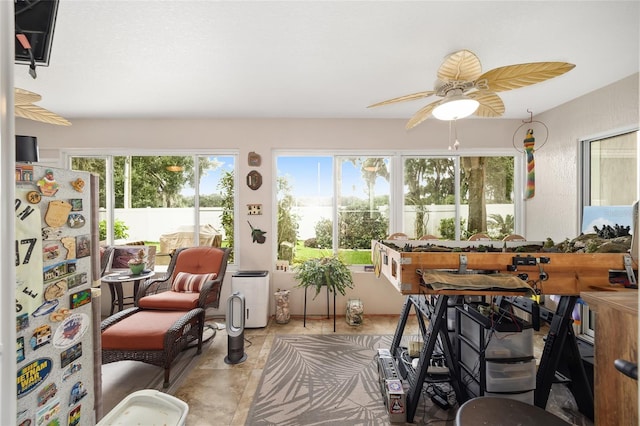 interior space featuring ceiling fan