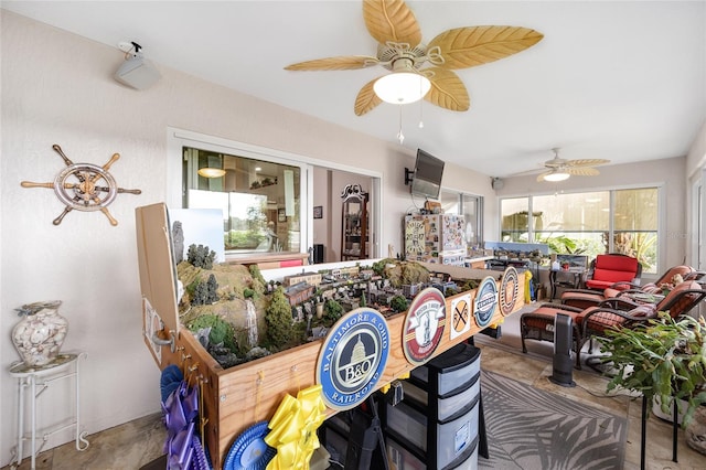 dining room with concrete flooring and ceiling fan