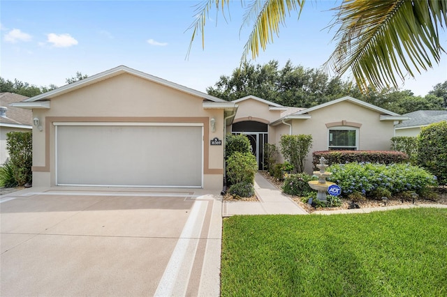 ranch-style home with a garage and a front yard