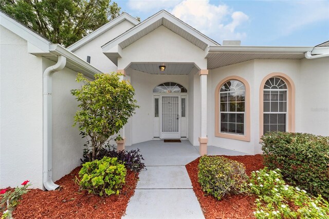 entrance to property with a porch