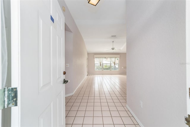 corridor featuring light tile patterned flooring