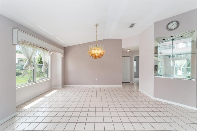 tiled empty room featuring lofted ceiling and a notable chandelier