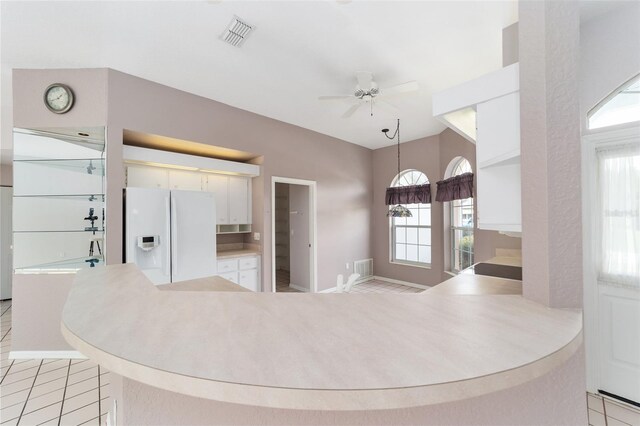 kitchen featuring decorative light fixtures, white cabinetry, kitchen peninsula, ceiling fan, and white fridge with ice dispenser