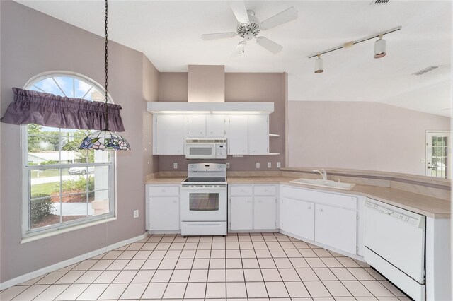 kitchen featuring white cabinetry, white appliances, plenty of natural light, and sink