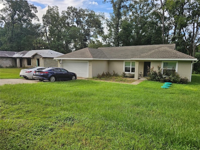 ranch-style house with a garage and a front lawn