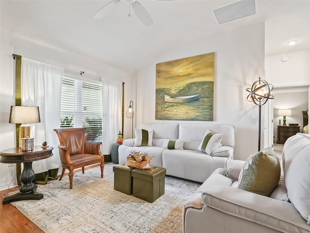 living room with light hardwood / wood-style floors and ceiling fan