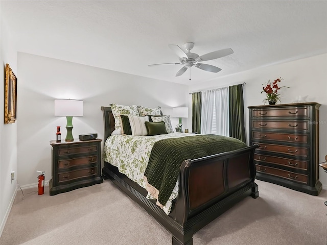 bedroom featuring ceiling fan and light colored carpet