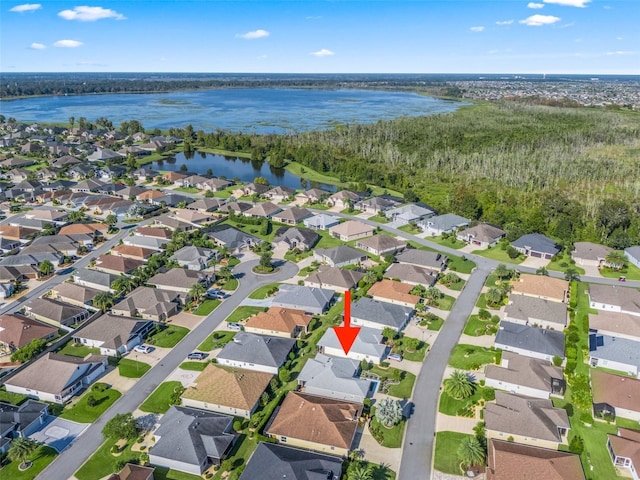 birds eye view of property featuring a water view