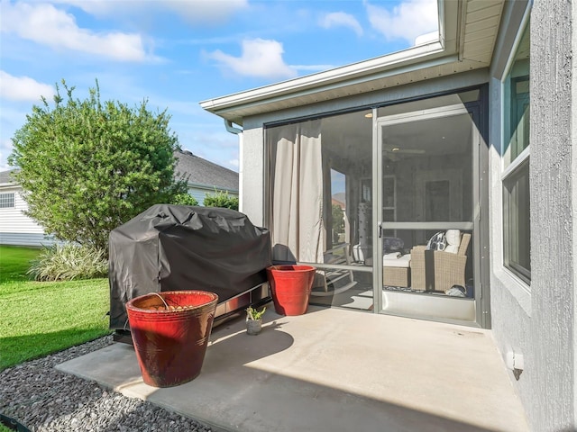 view of patio featuring a sunroom and area for grilling