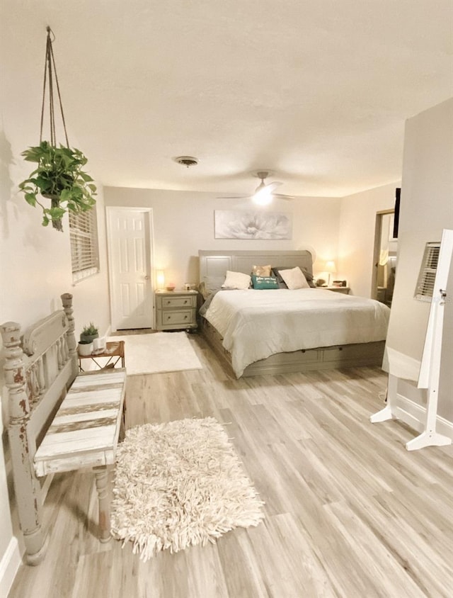 bedroom featuring ceiling fan and light hardwood / wood-style flooring