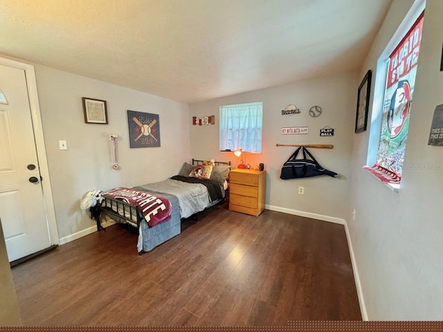 bedroom featuring dark hardwood / wood-style floors