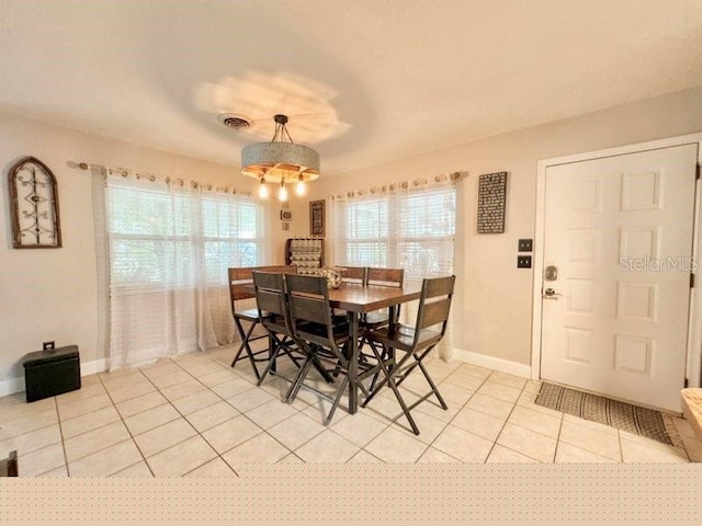 dining room with light tile patterned floors