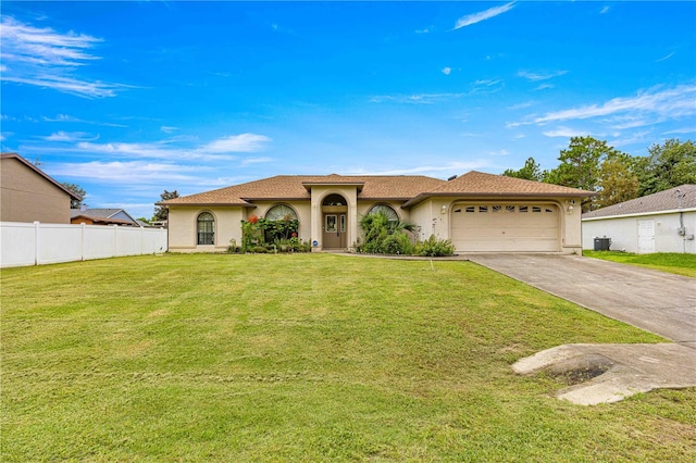 view of front of property with a front lawn and a garage