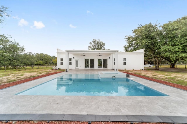 view of pool with ceiling fan and a patio