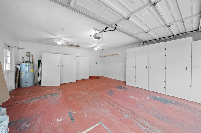 garage with water heater, a garage door opener, and ceiling fan