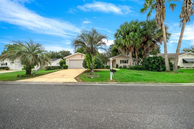 view of front of home featuring a front lawn and a garage