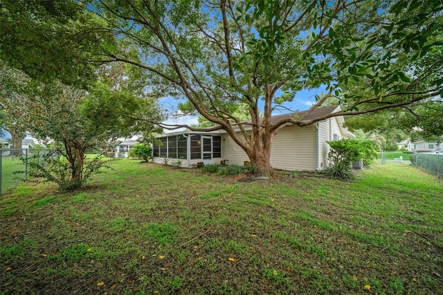 view of yard with a sunroom