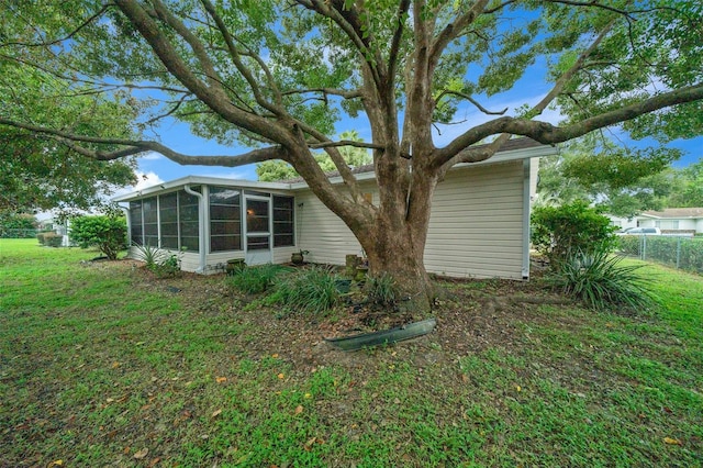 back of house with a sunroom