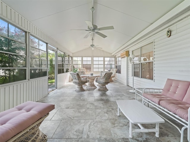 sunroom / solarium featuring vaulted ceiling