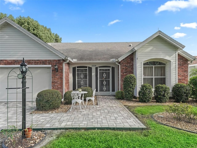 property entrance with a patio