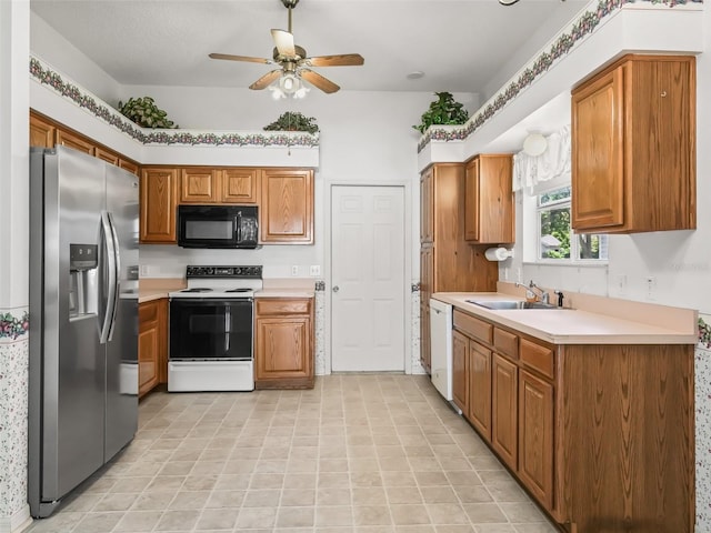 kitchen featuring white appliances, ceiling fan, and sink