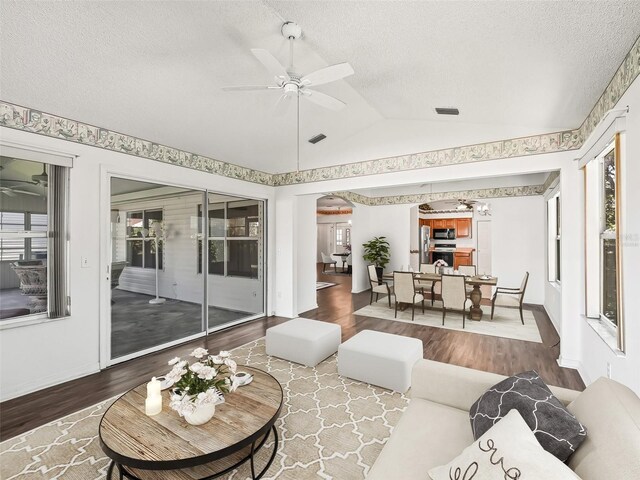 sunroom / solarium featuring ceiling fan and lofted ceiling