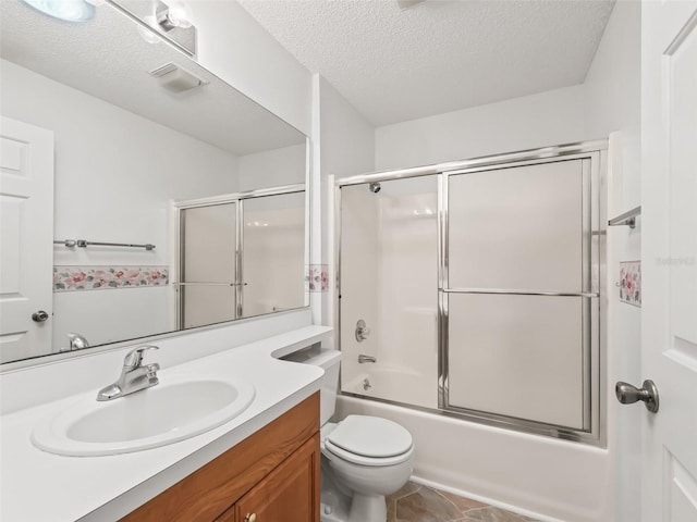 full bathroom with vanity, enclosed tub / shower combo, a textured ceiling, and toilet