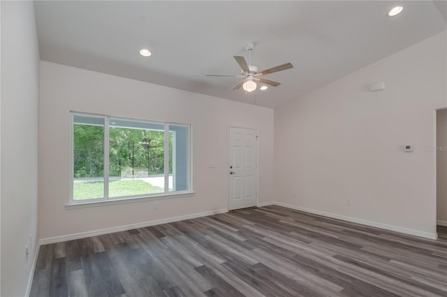 empty room with ceiling fan and dark hardwood / wood-style floors