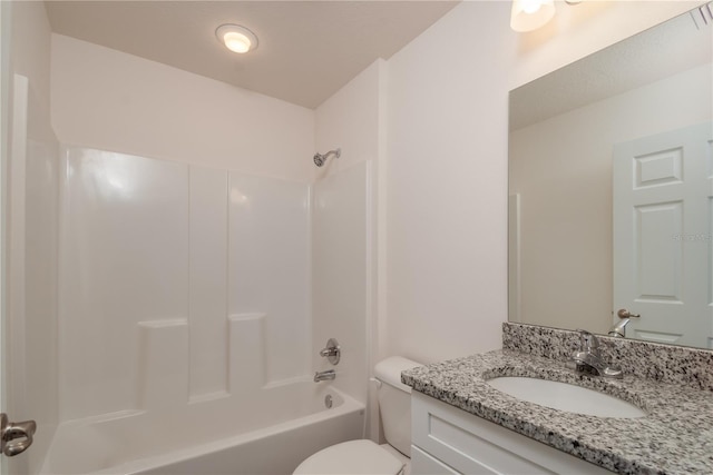 full bathroom with bathtub / shower combination, vanity, and toilet