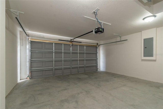 garage with electric panel and a garage door opener