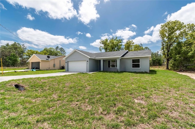 single story home with a garage and a front lawn