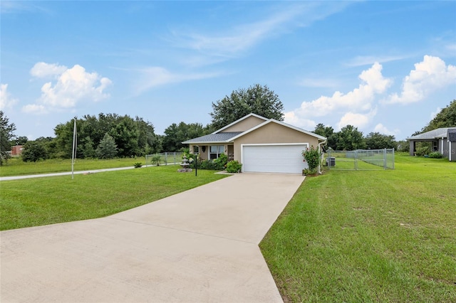 view of front of house with a front yard and a garage