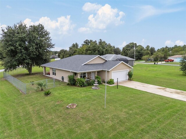 view of front of property with a garage and a front yard